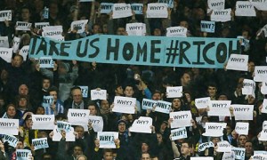 A fan protest against the club's move to Northampton was the highlight of the cup tie against Arsenal