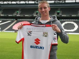 Apparently, Carl Baker now plays his football in Milton Keynes.